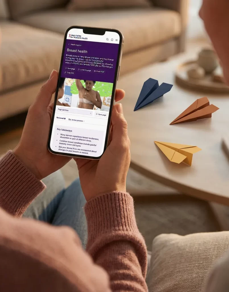 A woman learns about Jean Hailes for Wonen's Health, on her phone.
