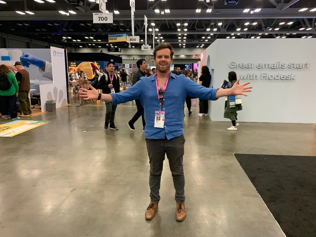 Excited Rhys stands, hands stretched out, in the SXSW festival hall.